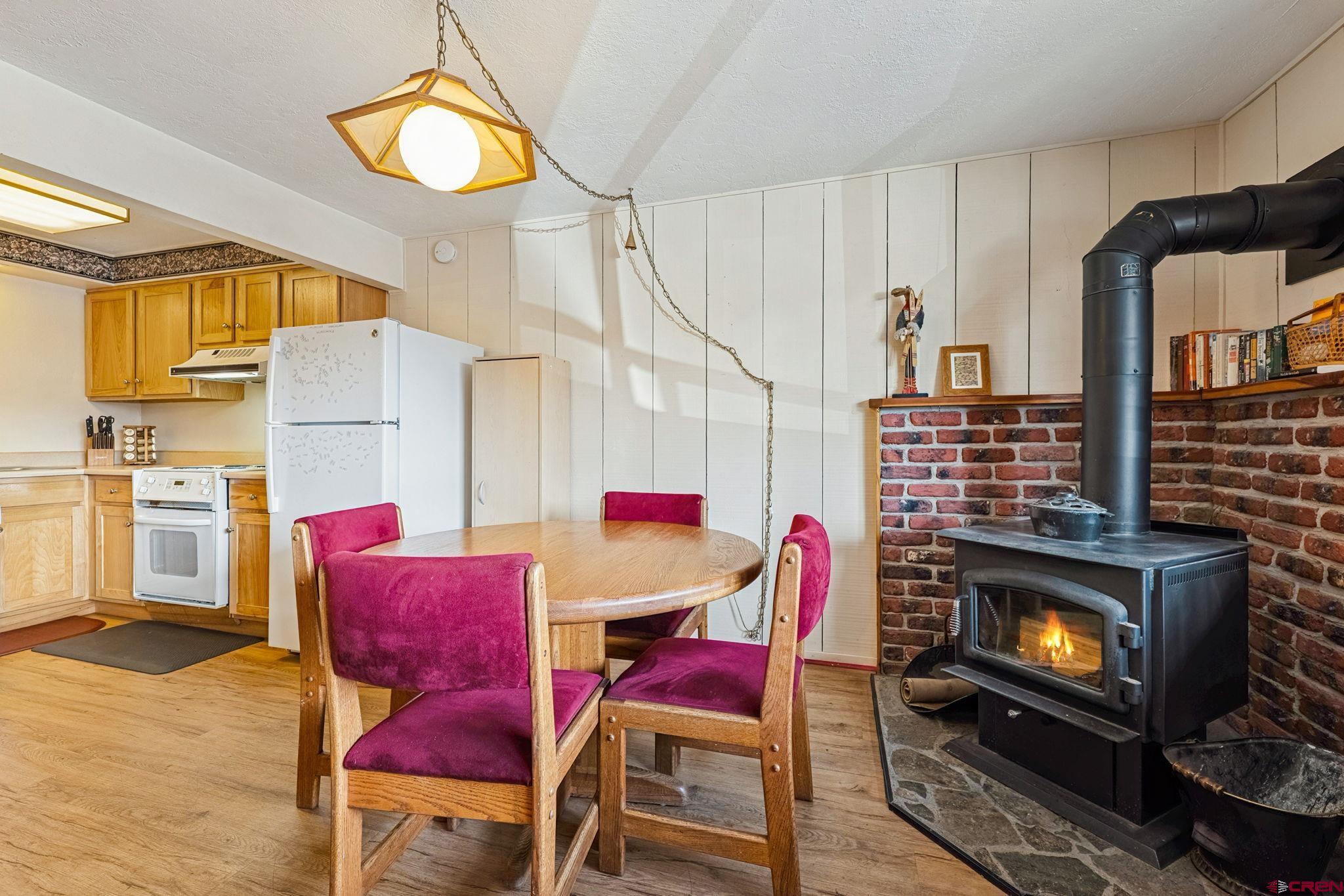 400 Sheol Street, Unit 7 Durango, CO 81301 - Photo 10 of 35 a view of a dining room with furniture and a fireplace