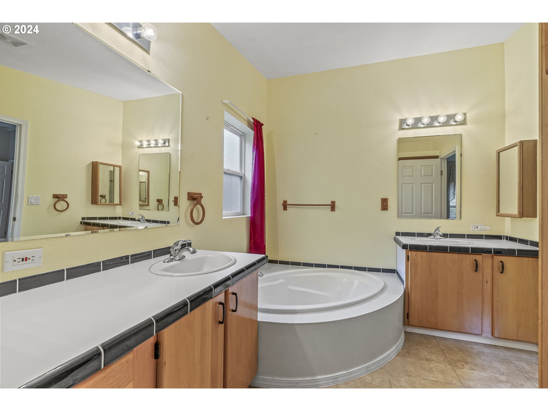400 Lapham Road Toutle, WA 98649 - Photo 16 of 37 a bathroom with a granite countertop sink a mirror and a bathtub