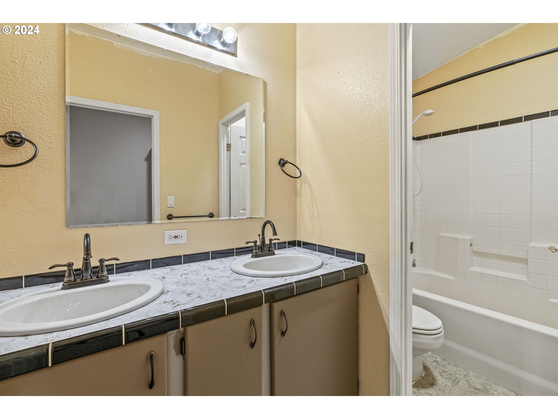400 Lapham Road Toutle, WA 98649 - Photo 17 of 37 a bathroom with a granite countertop sink and a mirror