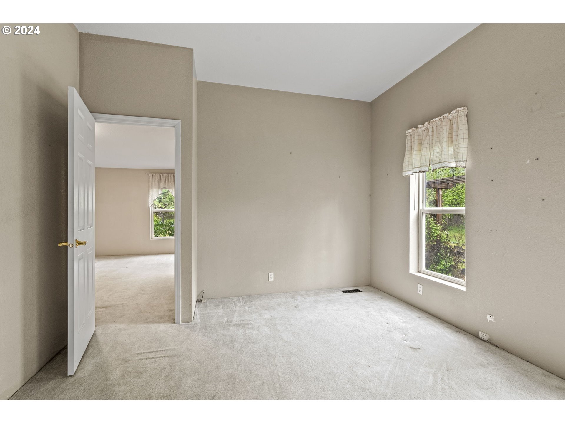 400 Lapham Road Toutle, WA 98649 - Photo 20 of 37 a view of an empty room with wooden floor and a window