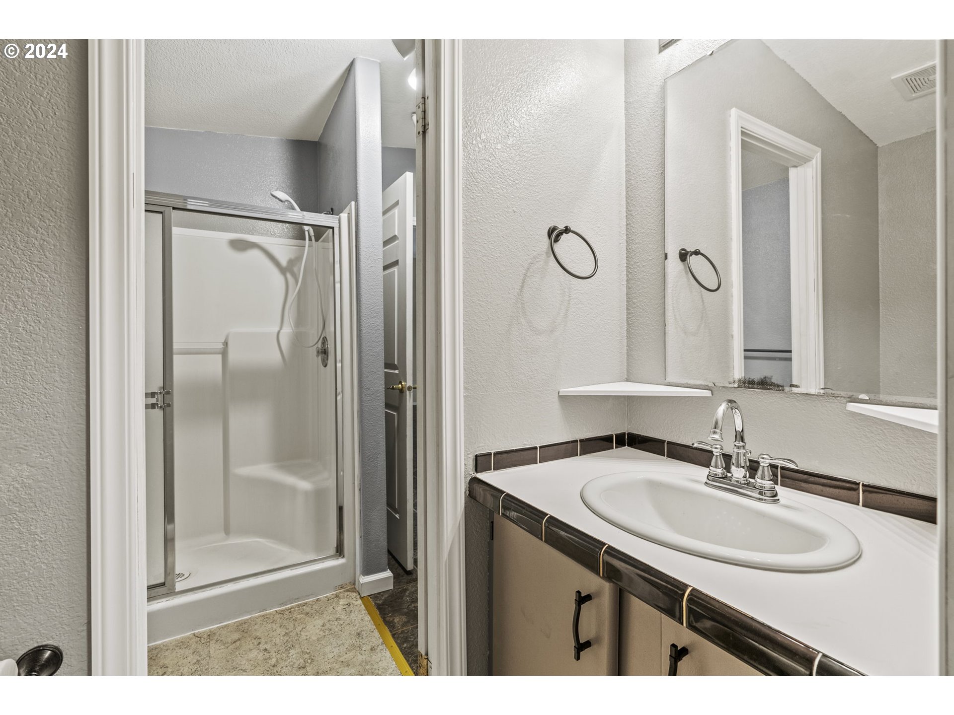 400 Lapham Road Toutle, WA 98649 - Photo 25 of 37 a bathroom with a granite countertop sink shower and a mirror