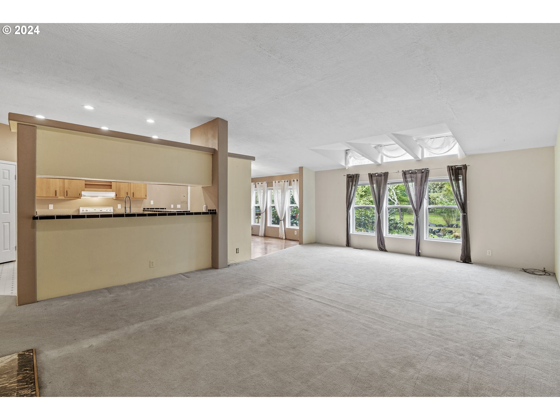 400 Lapham Road Toutle, WA 98649 - Photo 7 of 37 a view of a big room with windows and chandelier
