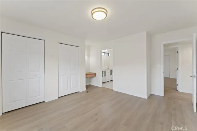 a spacious bathroom with a double vanity sink and mirror
