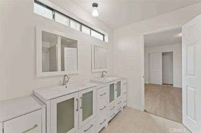 a white bath tub sitting next to a toilet