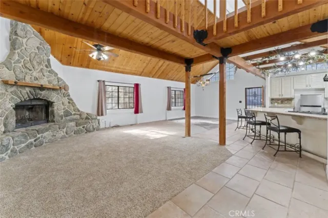 a view of a livingroom with furniture and a fireplace