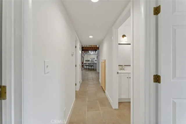a view of staircase with furniture and a window