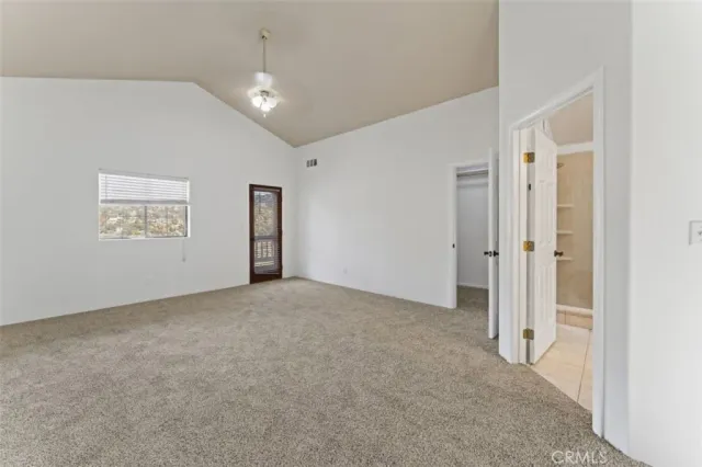 a view of a hallway with staircase