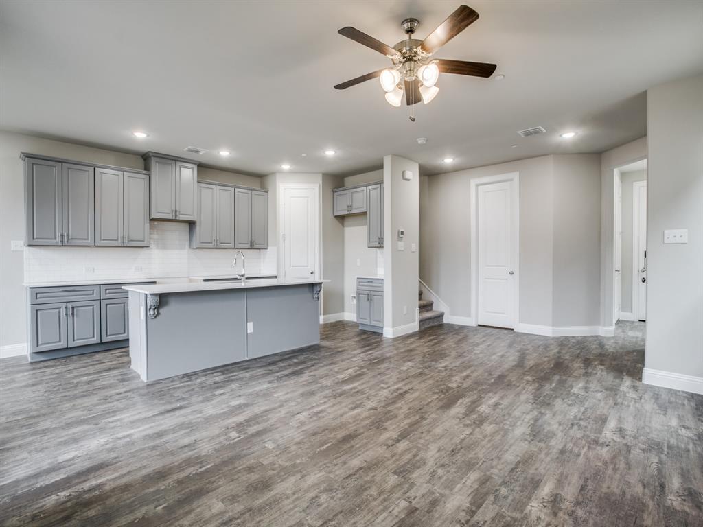 525 Teton Street Allen, TX 75002 - Photo 1 of 1 a view of kitchen with kitchen island wooden floor center island and stainless steel appliances