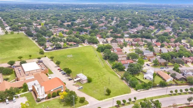 an aerial view of residential houses with outdoor space