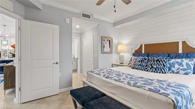 a bedroom with a large bed and a couch