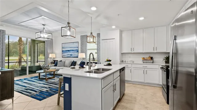 a kitchen with a sink stove and refrigerator