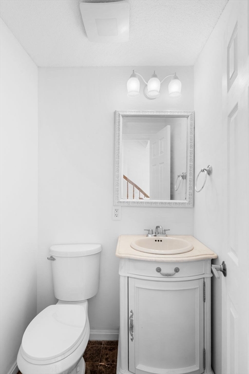 45 Abington Road, Unit 45 Danvers, MA 01923 - Photo 19 of 35 a bathroom with a sink toilet and a mirror