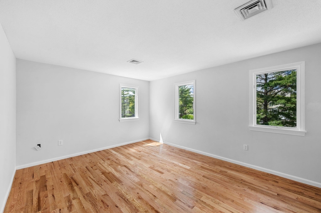 45 Abington Road, Unit 45 Danvers, MA 01923 - Photo 26 of 35 a view of empty room with wooden floor and fan
