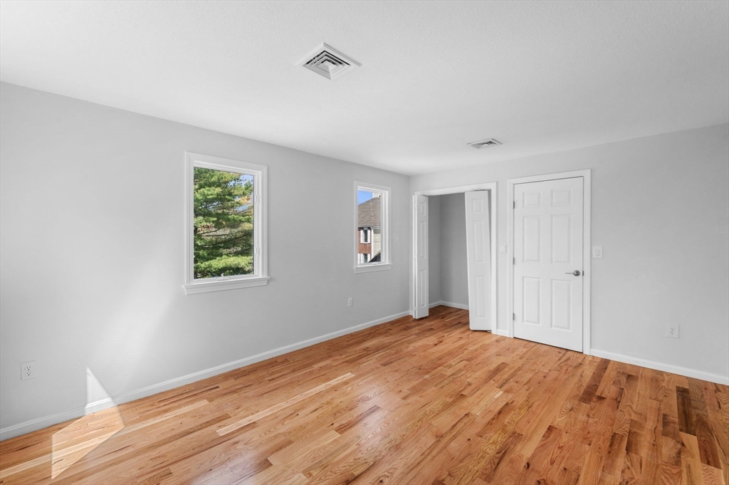 45 Abington Road, Unit 45 Danvers, MA 01923 - Photo 27 of 35 a view of empty room with wooden floor and fan