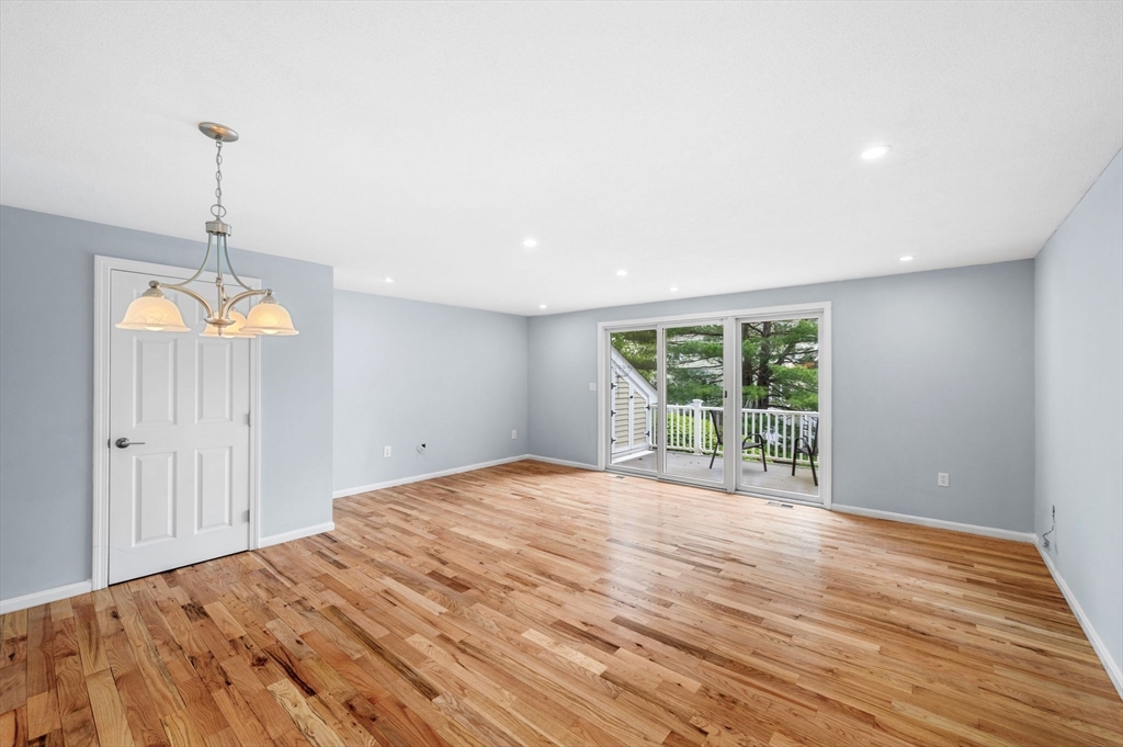 45 Abington Road, Unit 45 Danvers, MA 01923 - Photo 3 of 35 a view of empty room with wooden floor and fan