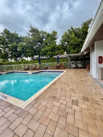 a view of swimming pool with a yard