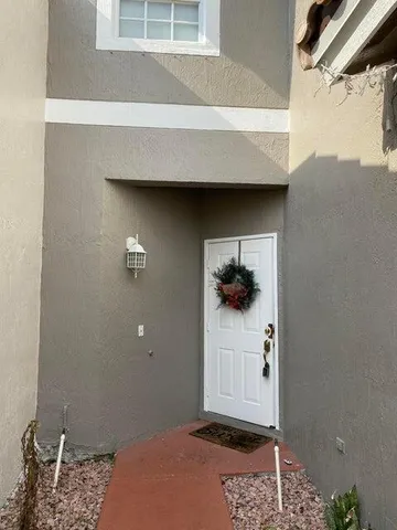 a kitchen with a stove top oven and cabinets