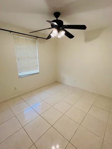 a bathroom with a sink a toilet a mirror and shower