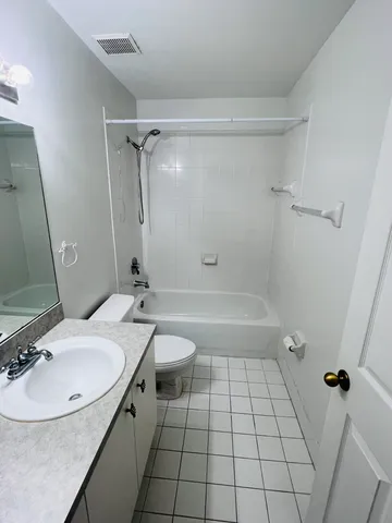 a kitchen with a sink stove and mirror