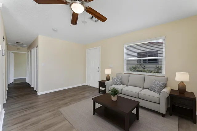 a living room with furniture and a window