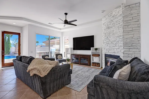 a living room with furniture and a flat screen tv
