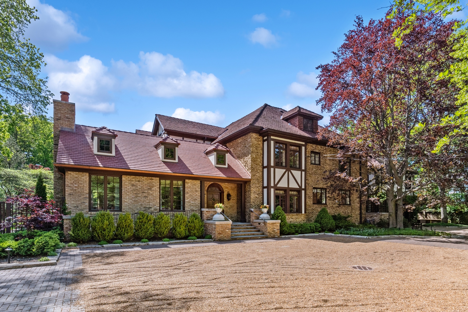 a front view of a house with garden