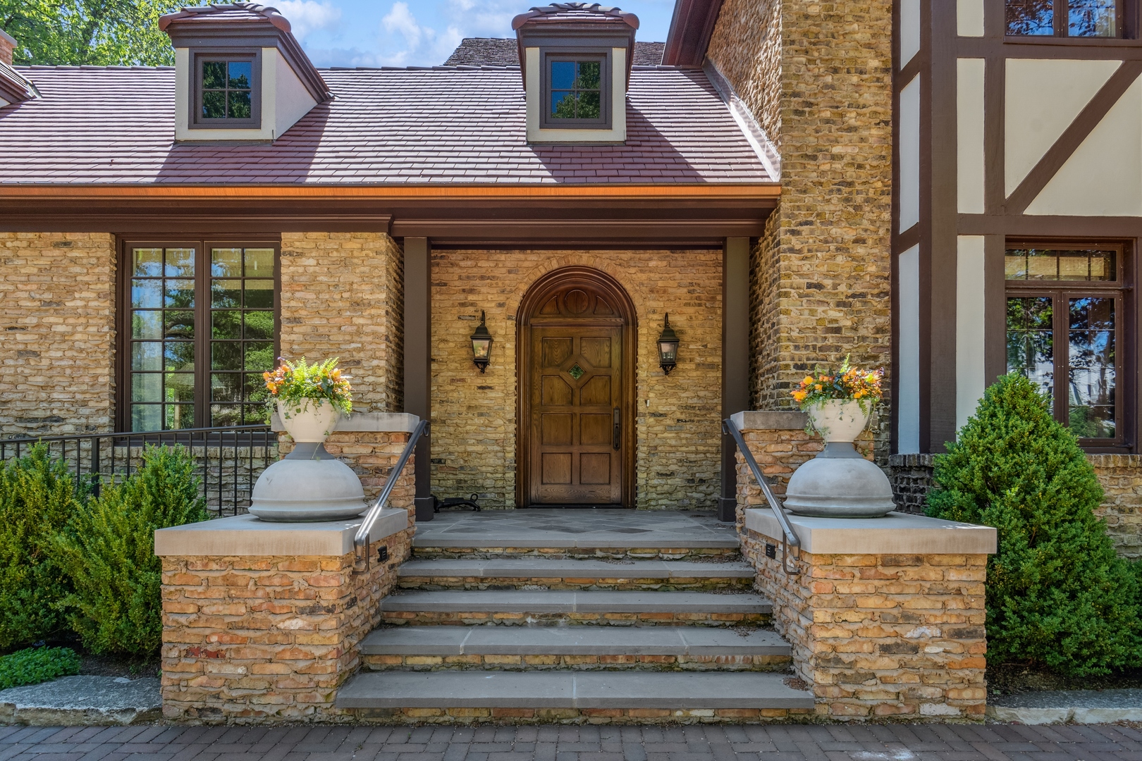 270 Birch Street Winnetka, IL 60093 - Photo 2 of 66 a front view of a house with a garden