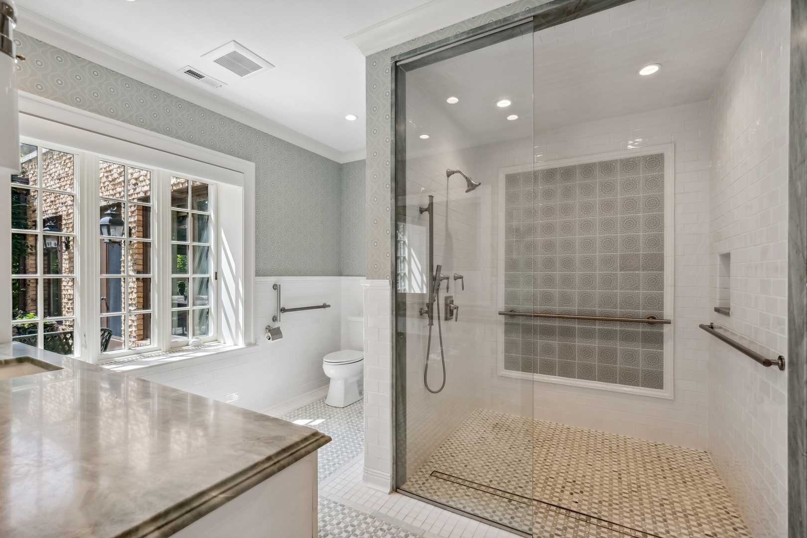 270 Birch Street Winnetka, IL 60093 - Photo 24 of 66 a bathroom with a granite countertop sink a toilet and shower