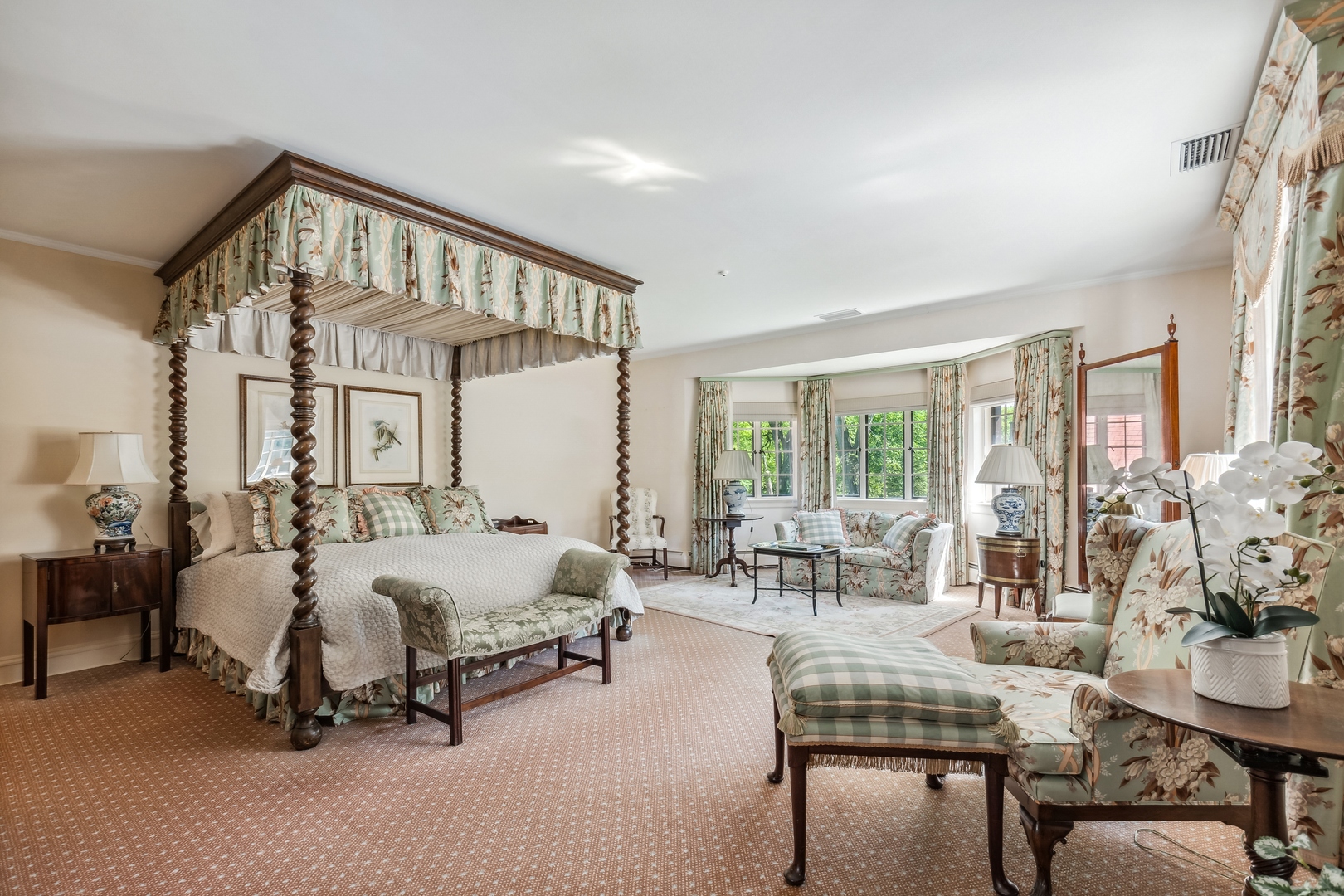 270 Birch Street Winnetka, IL 60093 - Photo 28 of 66 a spacious bedroom with a bed a table and large windows