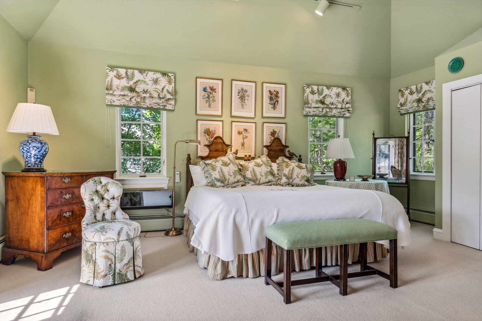 270 Birch Street Winnetka, IL 60093 - Photo 33 of 66 a bed sitting in a bedroom next to a window with a lamp and a large window