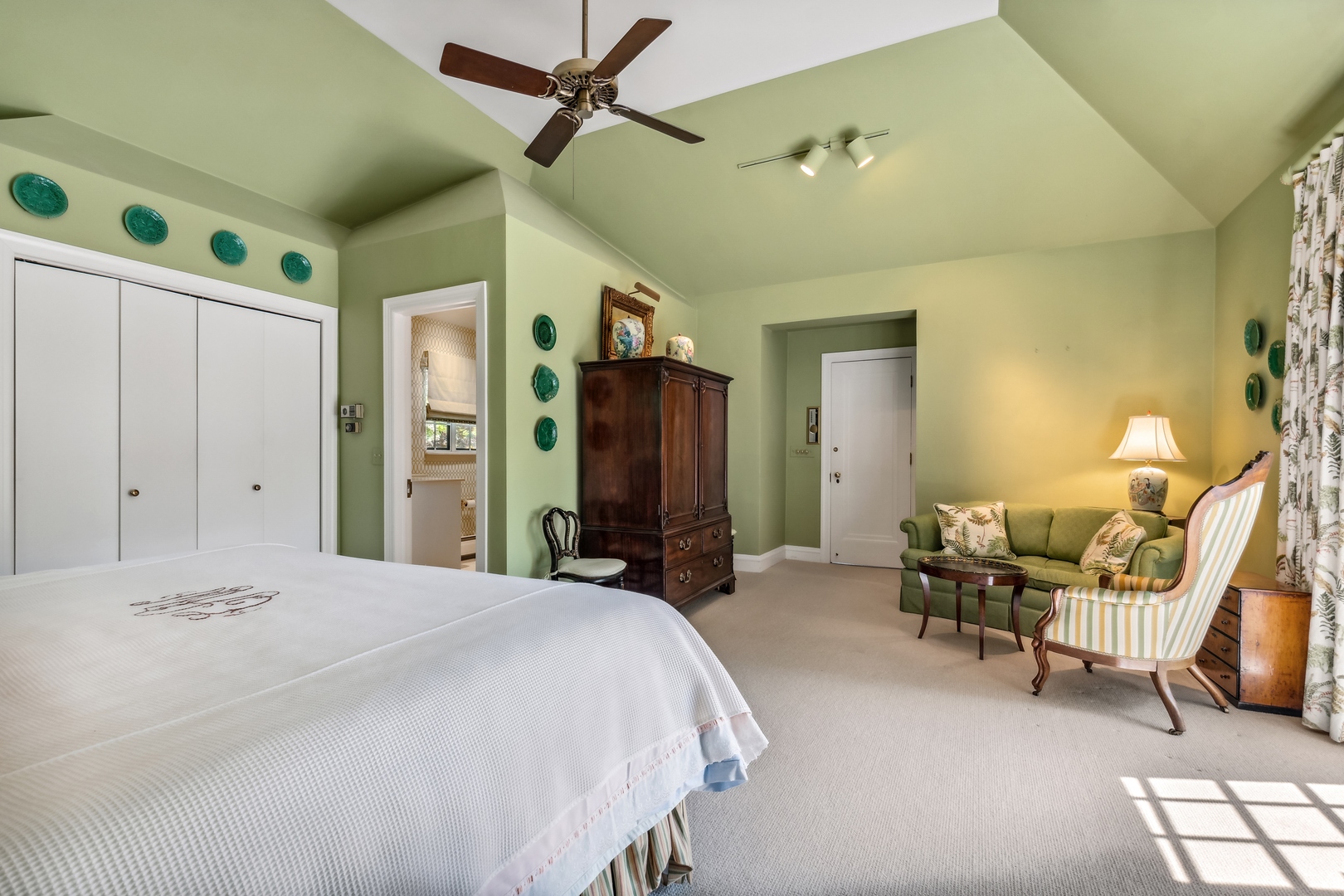 270 Birch Street Winnetka, IL 60093 - Photo 34 of 66 a spacious bedroom with a bed and a chandelier