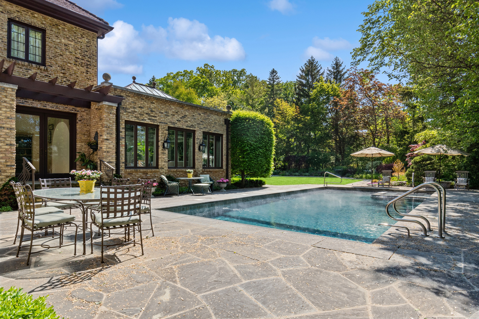 270 Birch Street Winnetka, IL 60093 - Photo 41 of 66 a view of a chair and tables in the patio