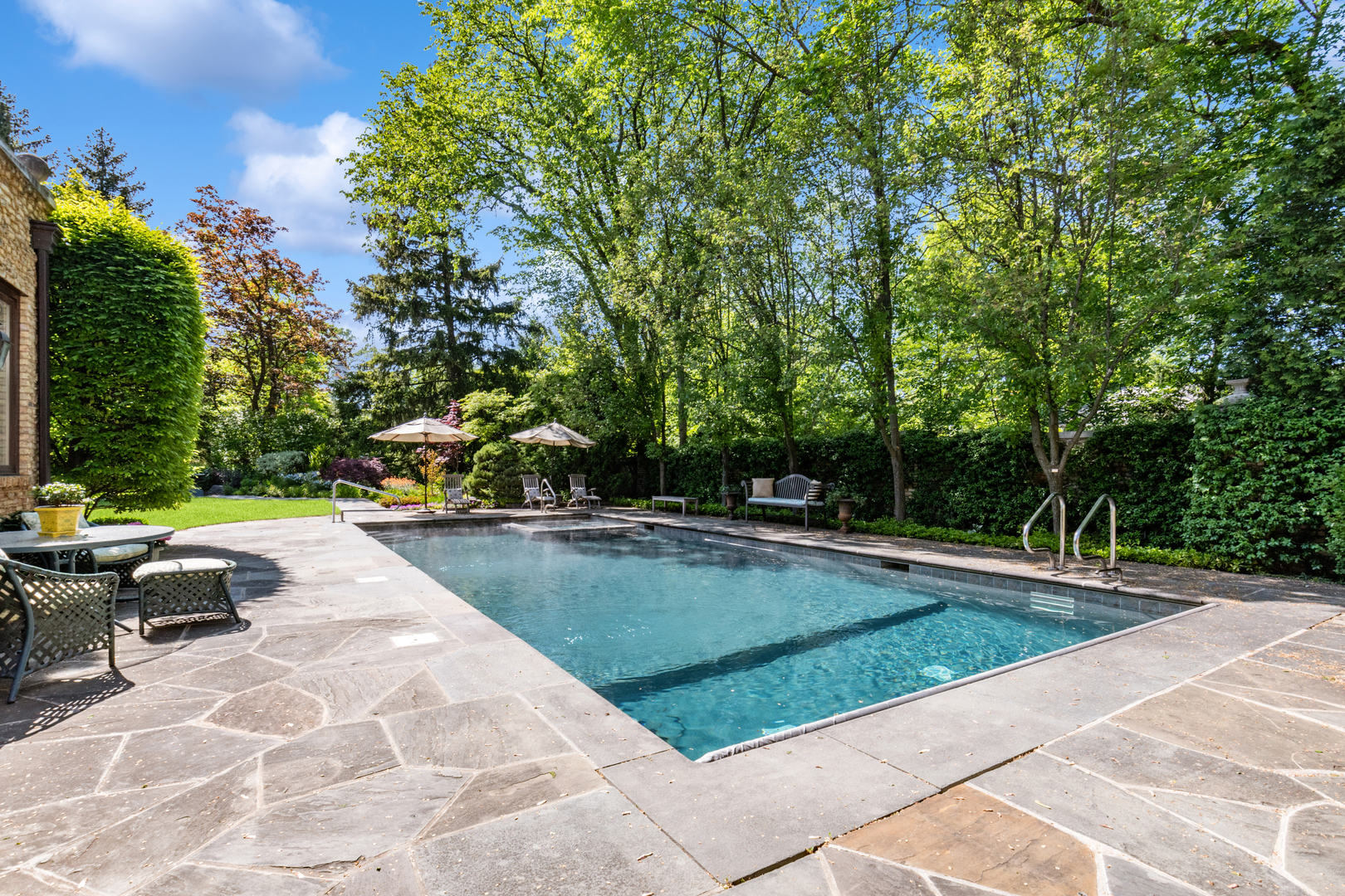 270 Birch Street Winnetka, IL 60093 - Photo 42 of 66 a view of swimming pool with chairs