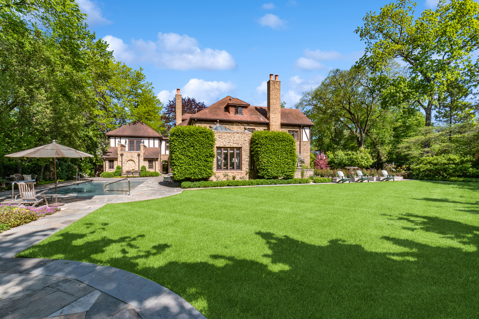 270 Birch Street Winnetka, IL 60093 - Photo 43 of 66 a front view of a house with garden