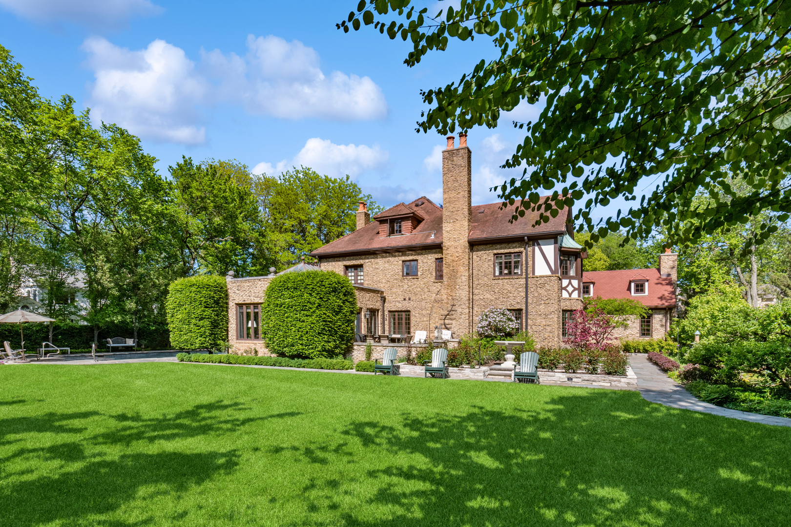 270 Birch Street Winnetka, IL 60093 - Photo 45 of 66 a front view of a house with garden