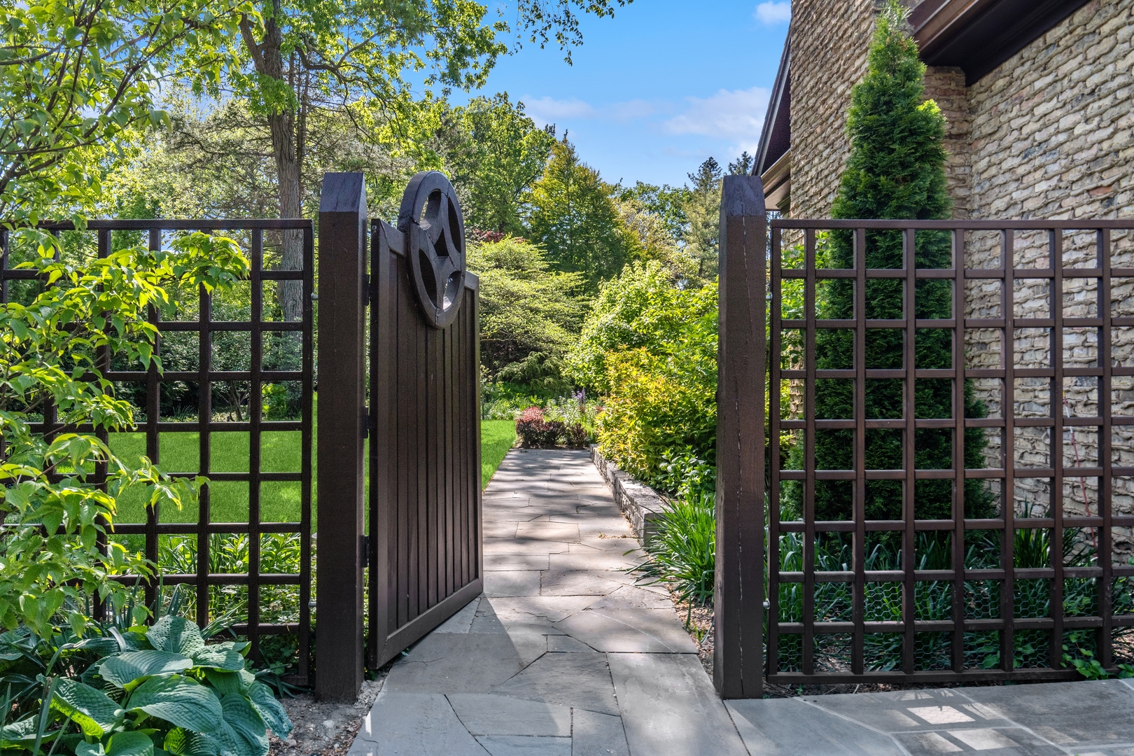 270 Birch Street Winnetka, IL 60093 - Photo 50 of 66 a view of a pathway with a tree in front of it