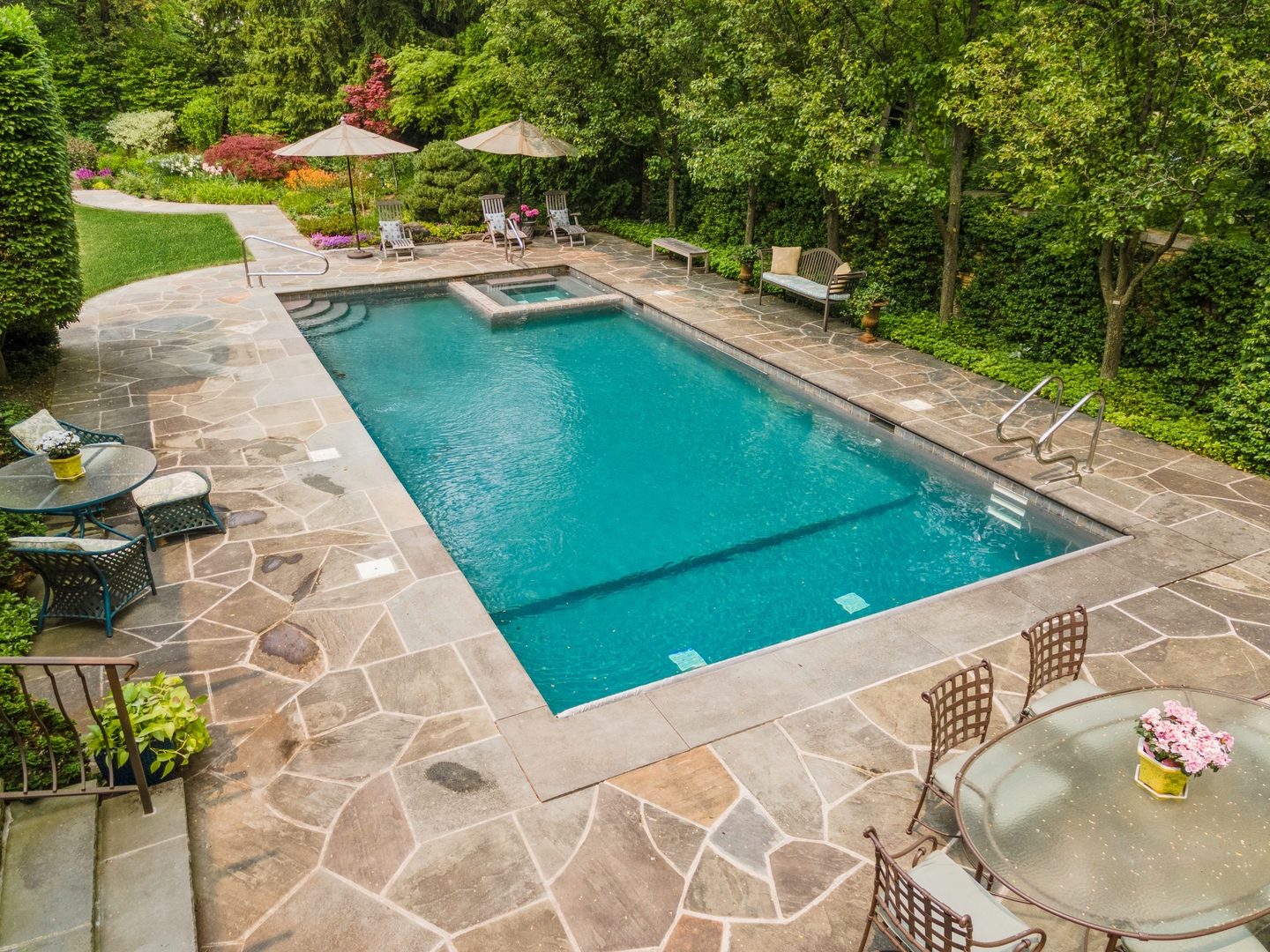 270 Birch Street Winnetka, IL 60093 - Photo 56 of 66 a view of a swimming pool with a patio