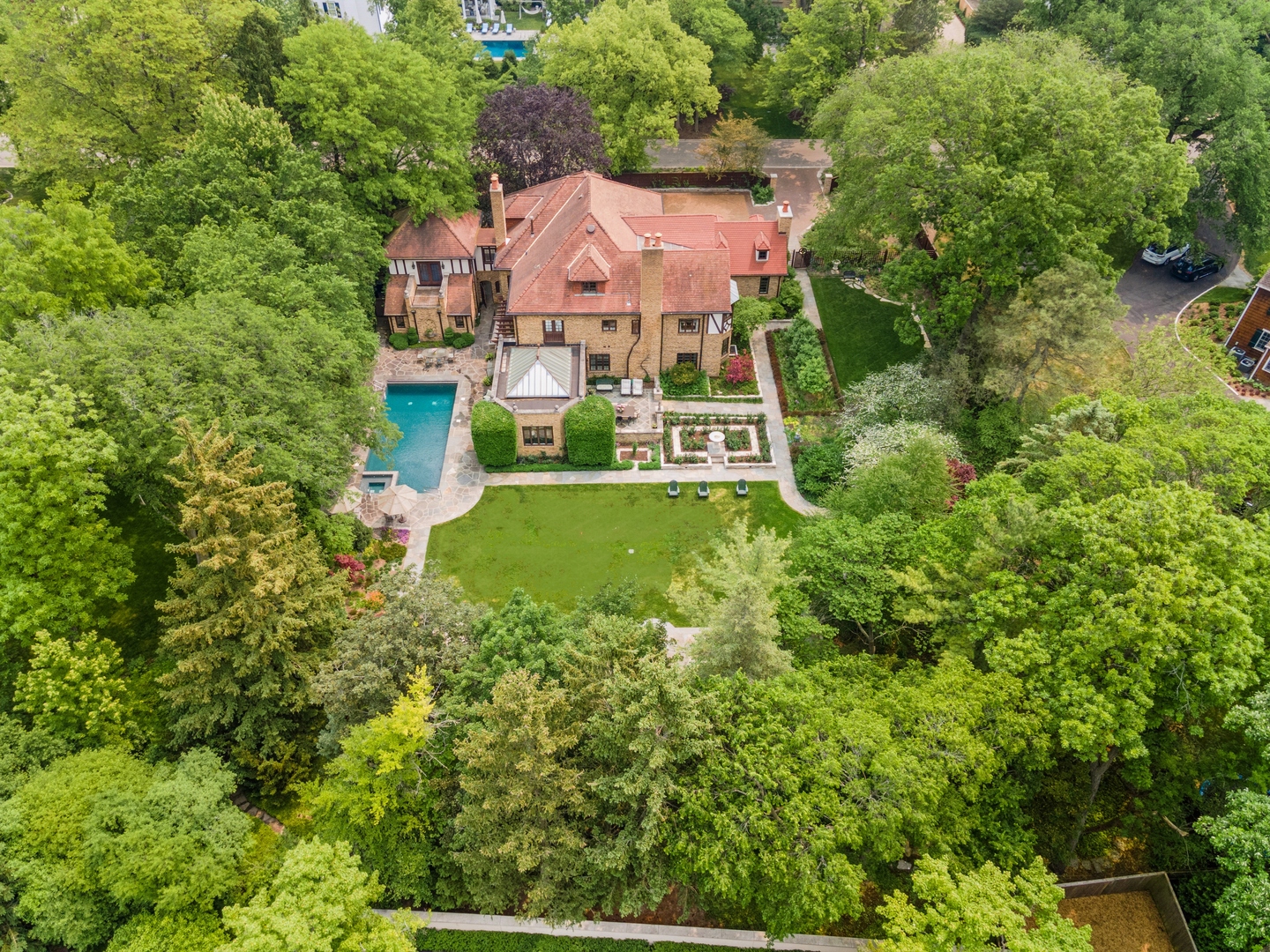 270 Birch Street Winnetka, IL 60093 - Photo 57 of 66 a view of a house with a big yard and large trees
