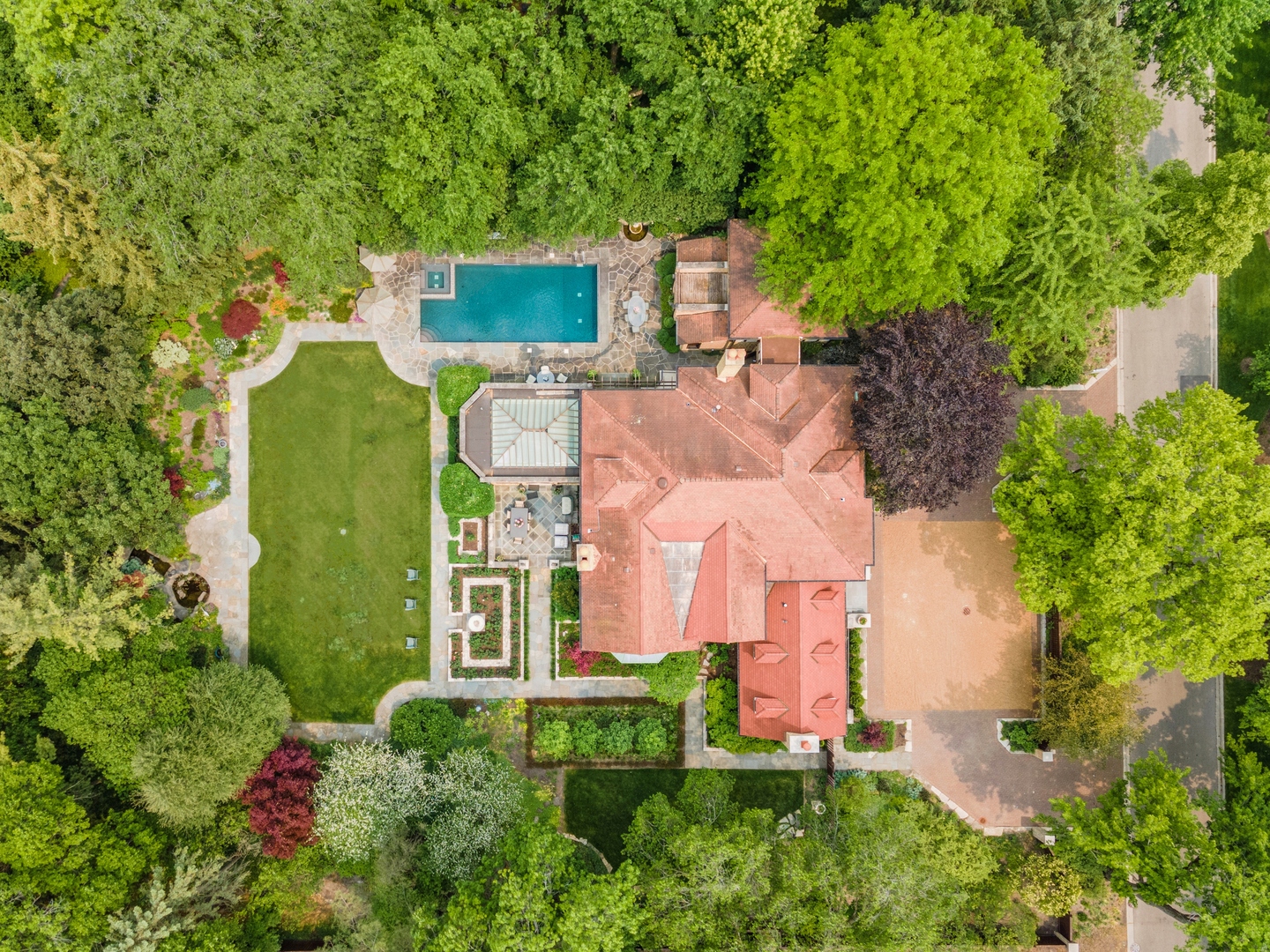 270 Birch Street Winnetka, IL 60093 - Photo 58 of 66 an aerial view of a house with swimming pool and garden