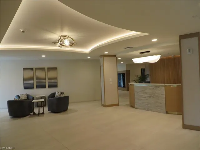 a view of a livingroom with furniture and a flat screen tv