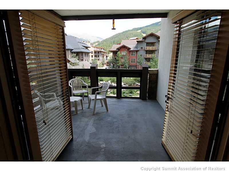 910 Copper Road, Unit 214 Copper Mountain, CO 80443 - Photo 8 of 15 a view of a porch with a table and chairs
