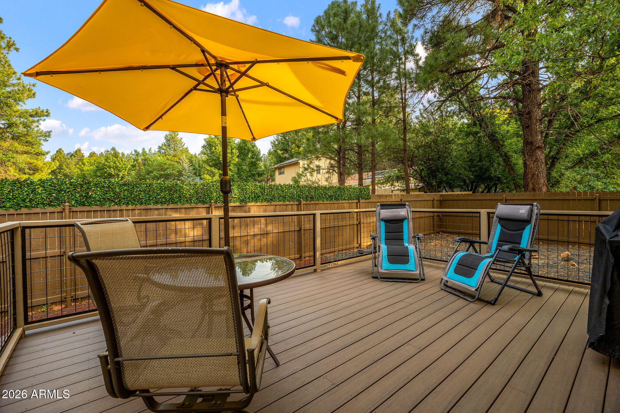 5145 Drifting Snow Loop Pinetop, AZ 85935 - Photo 4 of 37 a view of a balcony with chairs and wooden floor