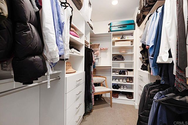 a living room with furniture a window and a potted plant