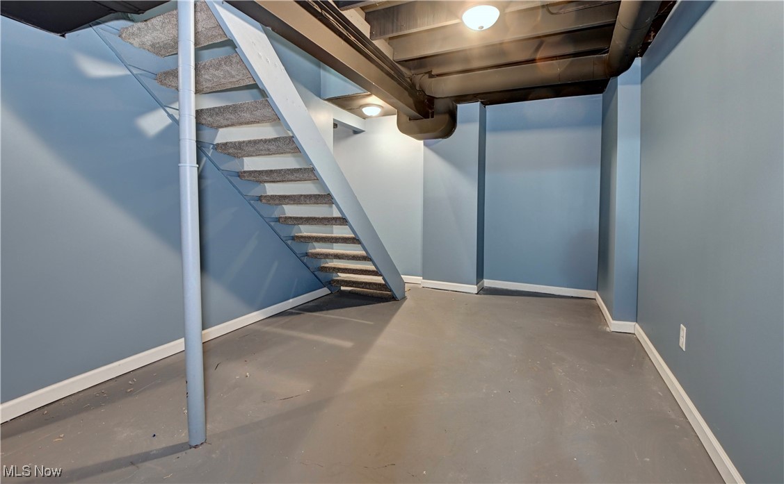 4624 Ridge Avenue Southeast Canton, OH 44707 - Photo 42 of 48 Finished below grade area with baseboards and stairway