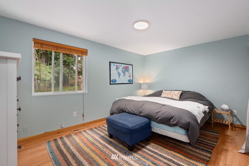 18216 19th Drive Southeast Bothell, WA 98012 - Photo 12 of 37 a bedroom with a bed couch and window