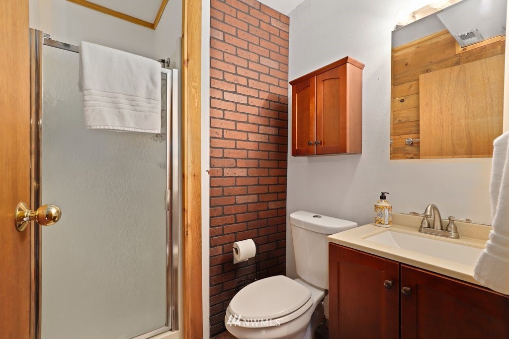 18216 19th Drive Southeast Bothell, WA 98012 - Photo 18 of 37 a bathroom with a sink a toilet and shower