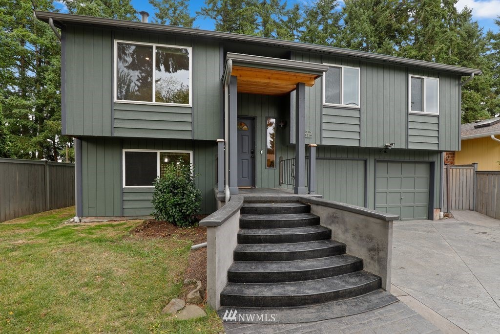 18216 19th Drive Southeast Bothell, WA 98012 - Photo 2 of 37 a front view of a house with a yard