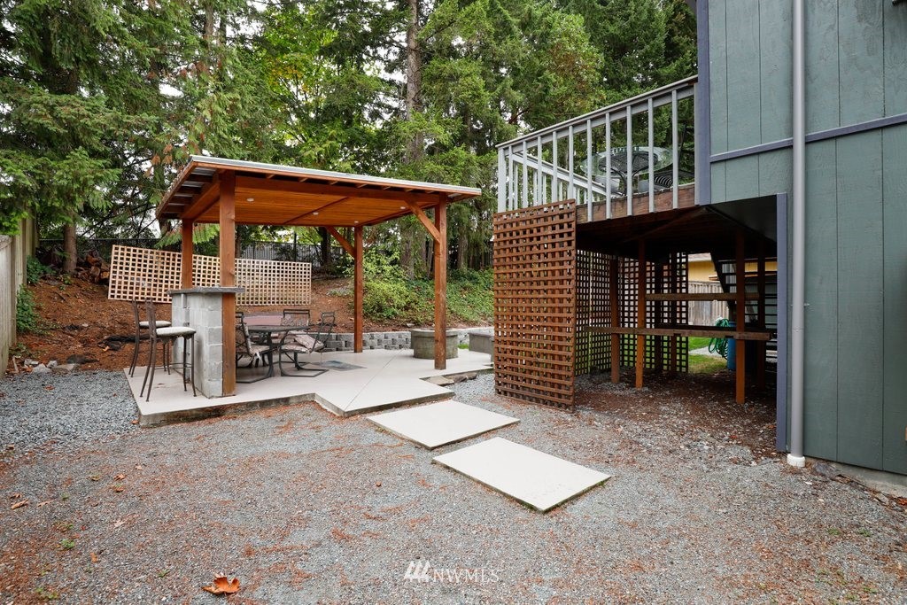 18216 19th Drive Southeast Bothell, WA 98012 - Photo 24 of 37 a view of a patio with a table and chairs under an umbrella