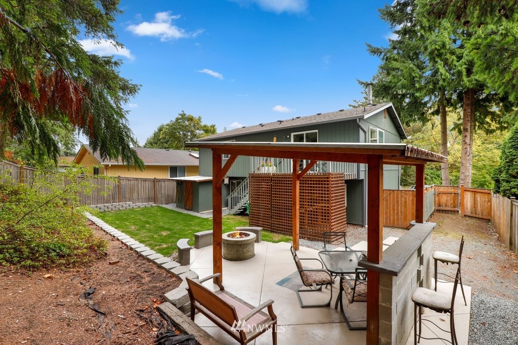 18216 19th Drive Southeast Bothell, WA 98012 - Photo 26 of 37 a view of a patio with table and chairs and potted plants