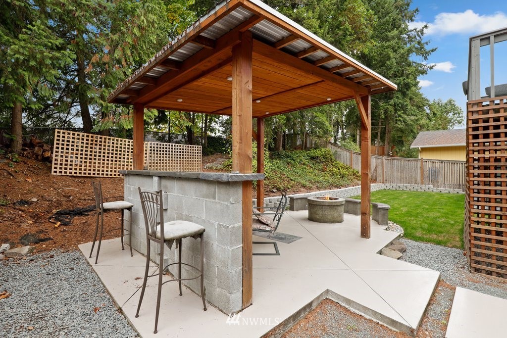 18216 19th Drive Southeast Bothell, WA 98012 - Photo 34 of 37 a patio with table and chairs